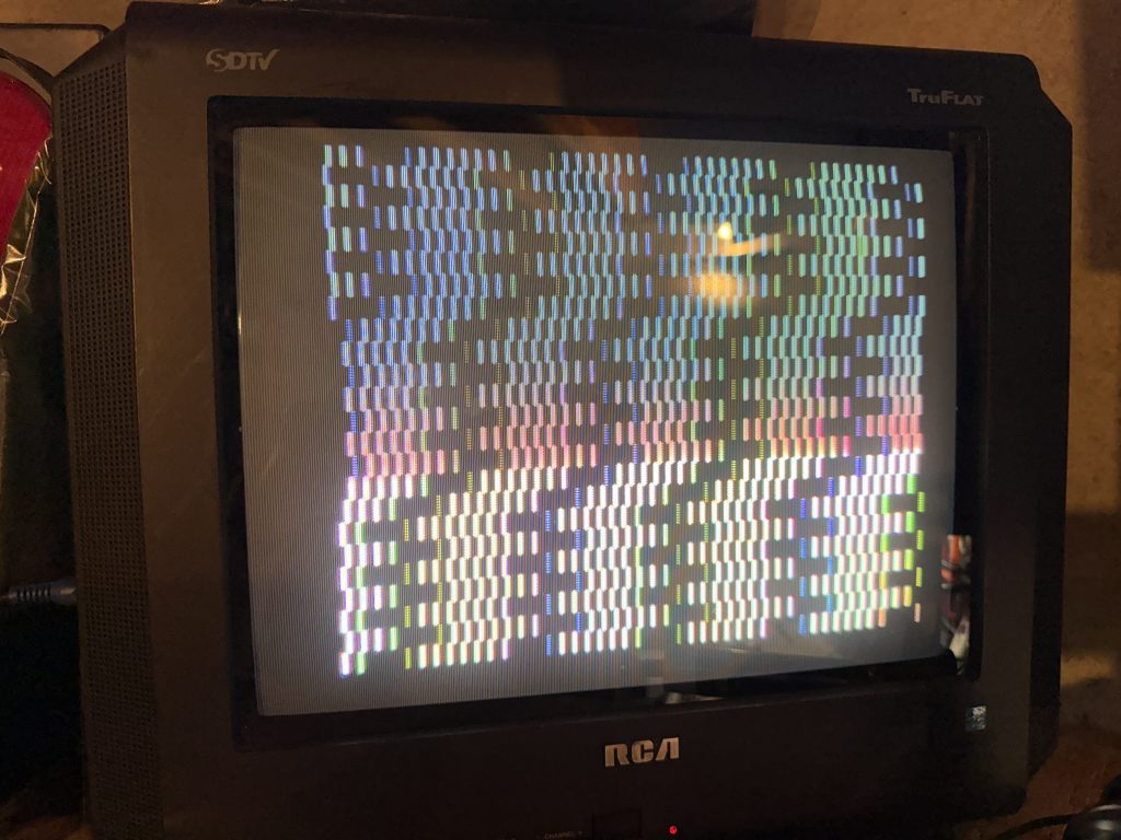 a CRT television displaying rainbow bars