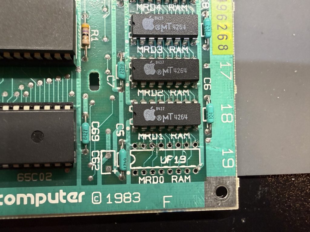 an Apple //c motherboard with a removed chip in the MRD0 RAM position