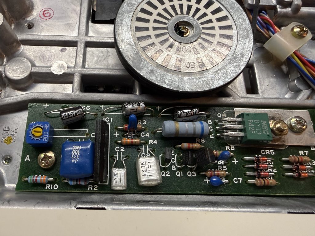 a close up of an Apple //c floppy driving showing replaced capacitors