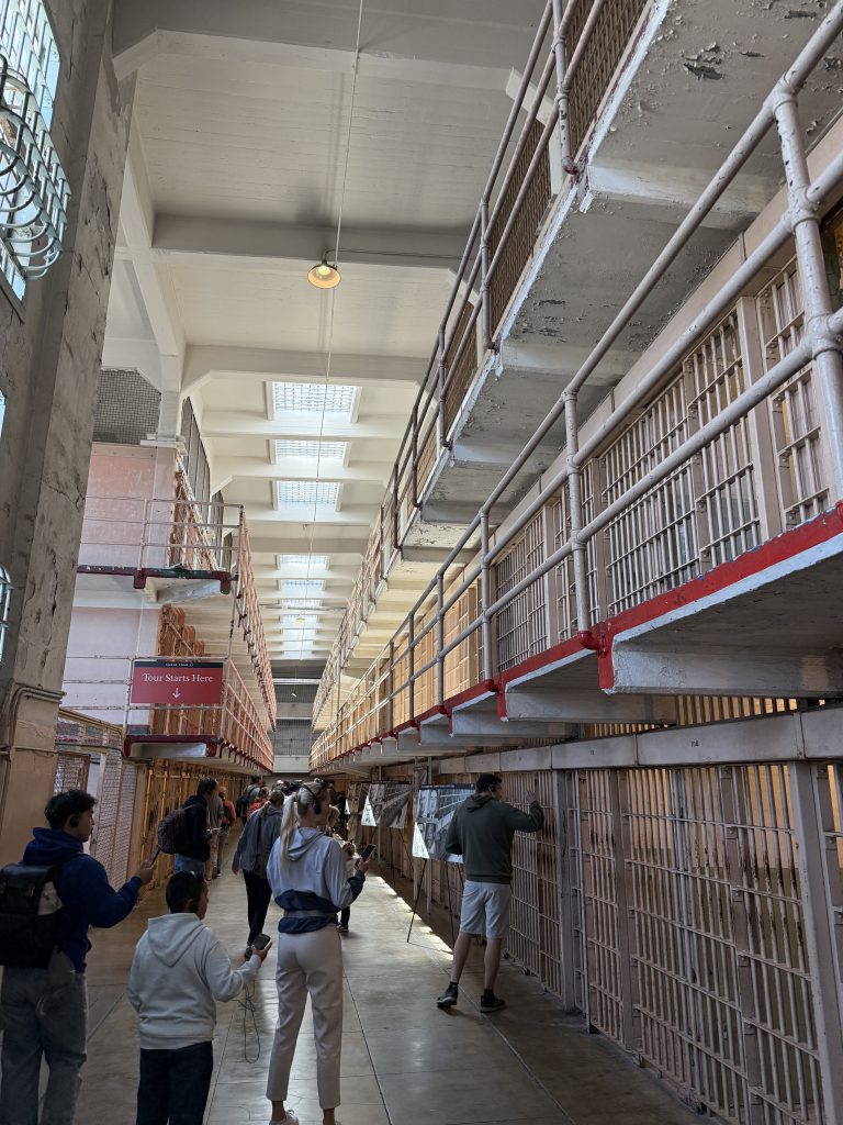 a view down a corridor of prison cells in alcatraz