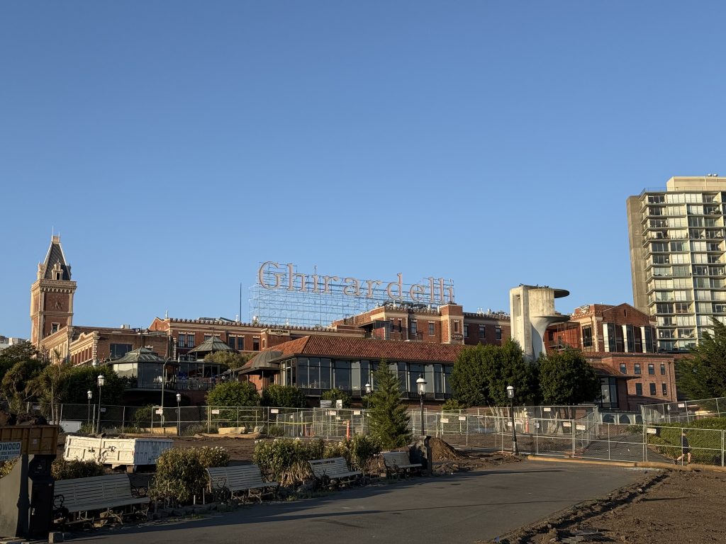 a large factory with the word "Ghirardelli" on the roof