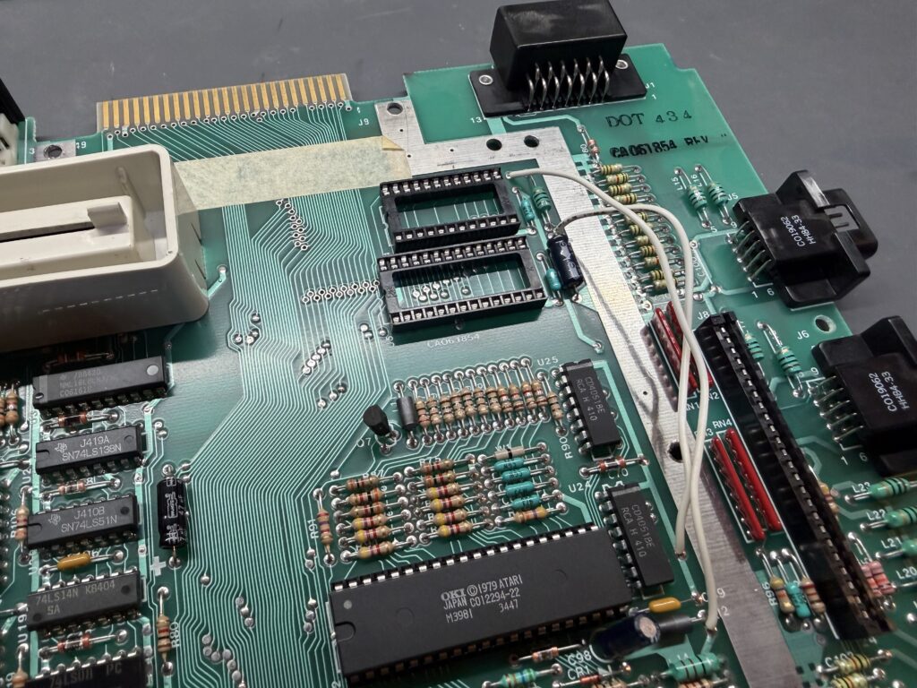 a closeup of a PCB. there are two empty sockets on the board