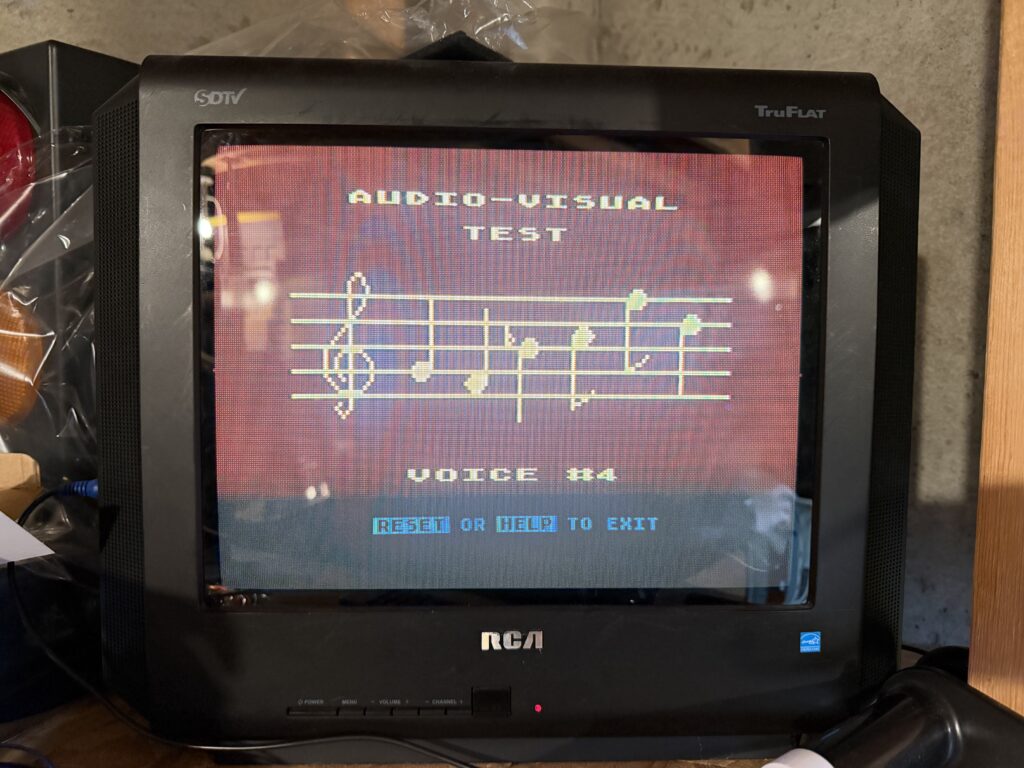 a television showing music notes and the text "Audio-visual test"